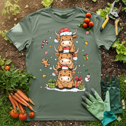 Cute Highland Cow Christmas T-Shirt featuring adorable Highland cows in Santa hats and festive elements.